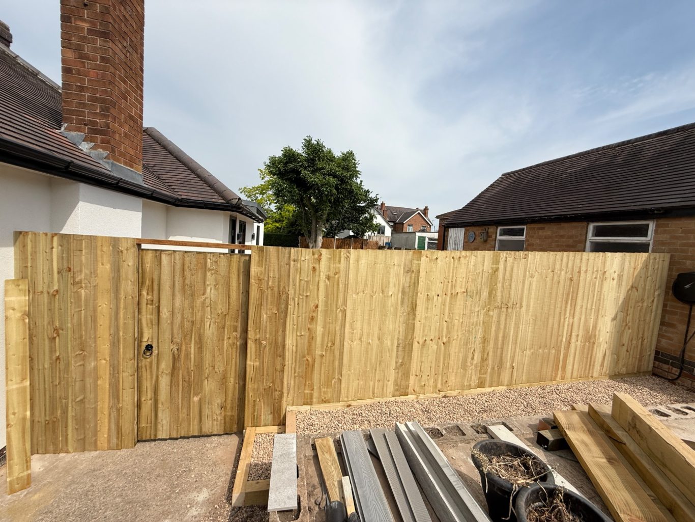 Post and rail style fencing with custom built gate
