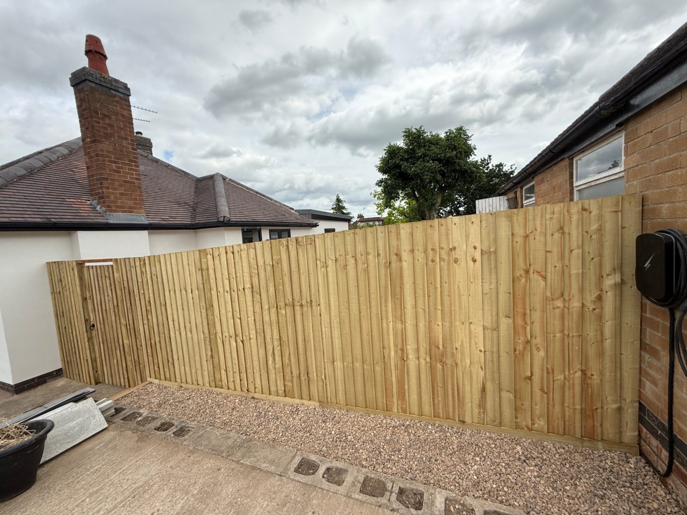 Post and rail style fencing with custom built gate